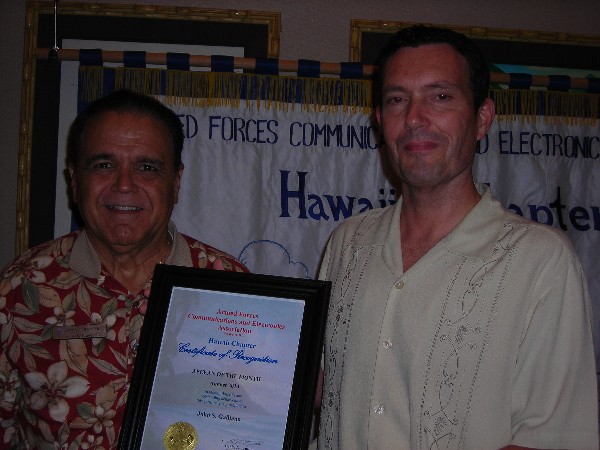 Lindo (l) congratulates the August AFCEAN of the Month, Galliano.
